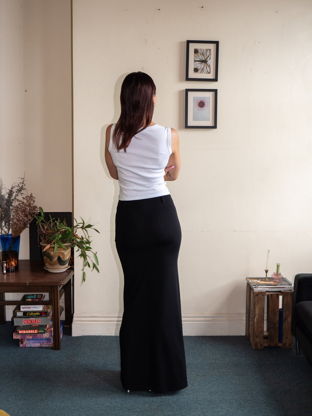 Back view of fitted long pencil skirt, black