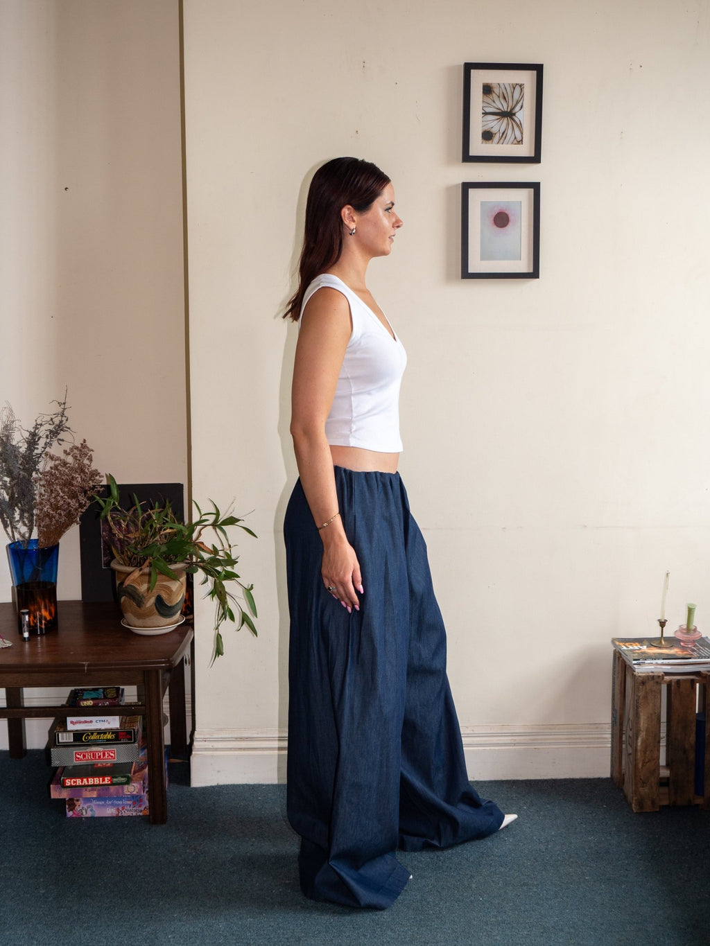 Side view of wide-leg cotton pants with elastic waist, denim